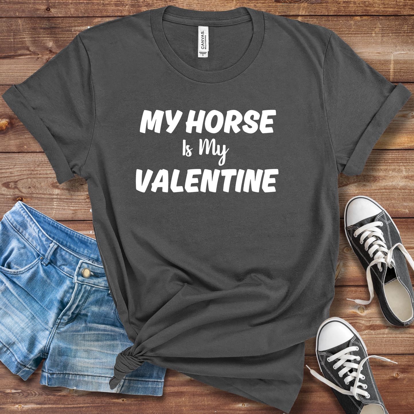 A person wearing a "My Horse Is My Valentine" asphalt t-shirt, showcasing a stylish design, perfect for horse lovers and casual wear.