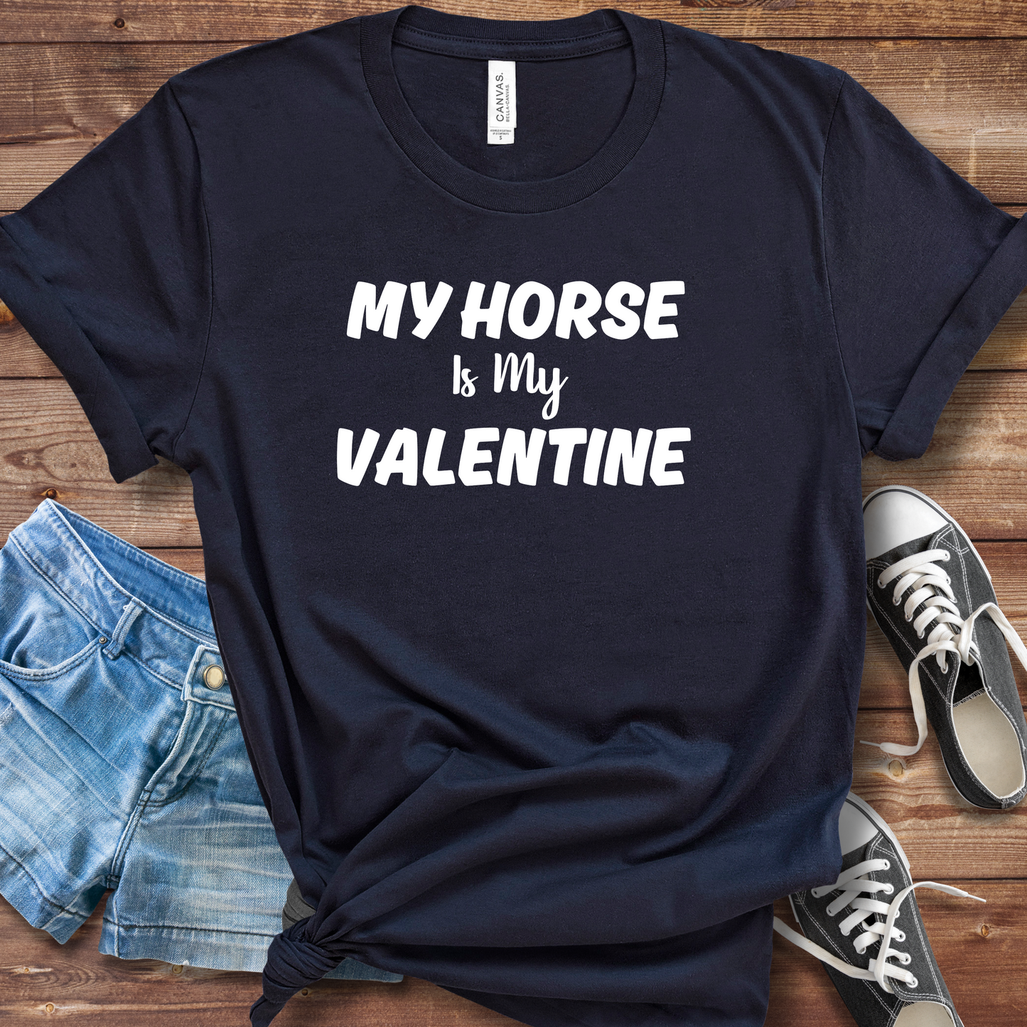 A person wearing a "My Horse Is My Valentine" navy t-shirt, showcasing a stylish design, perfect for horse lovers and casual wear.