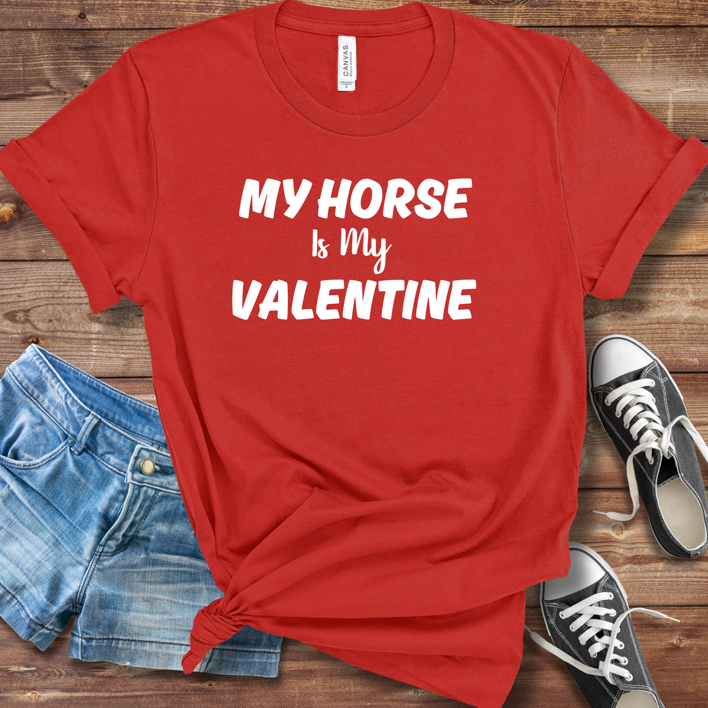 A person wearing a "My Horse Is My Valentine" red t-shirt, showcasing a stylish design, perfect for horse lovers and casual wear.